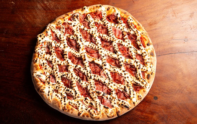 Meat Lover Supreme pizza with pepperoni sausage and bacon
