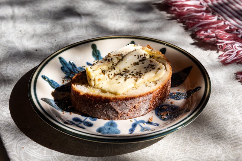 Garlic cheese bread side with herb butter and marinara dip